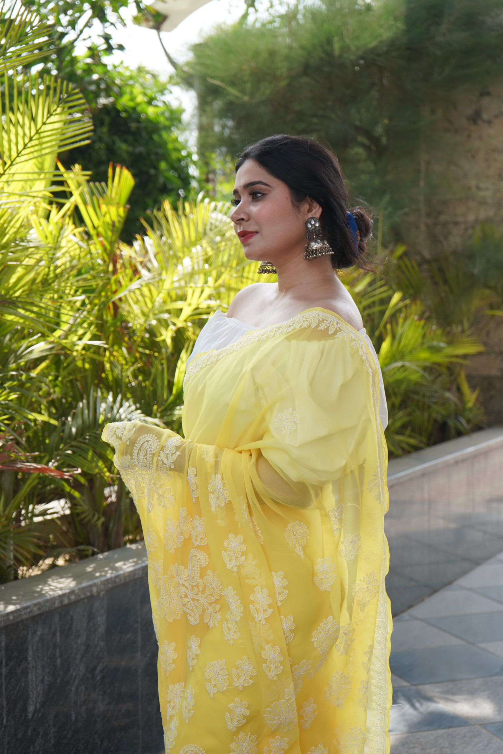 PRI08229 Girl wearing yellow Chikankari Saree
